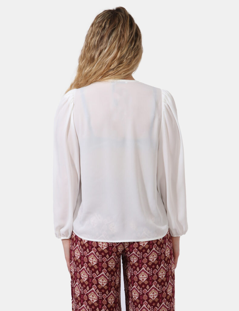 Blusa Caractere Bianco - Blusa velata a maniche lunghe in total bianco e con scollo a V. La vestibilità è morbida e regolare